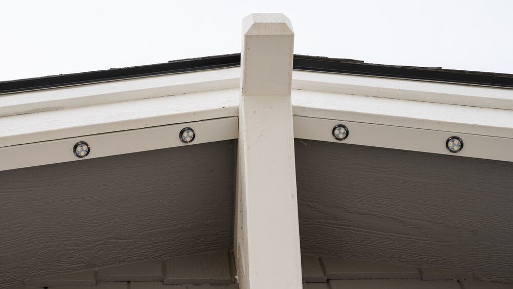 Permanent lighting track blended into the roofline in daylight