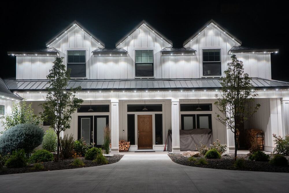 Home lit with permanent roofline lighting